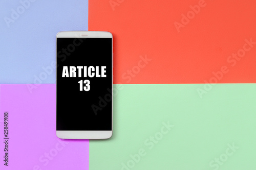 Modern smartphone with black screen on texture background of fashion pastel blue, yellow, violet and pink colors paper in minimal concept. photo