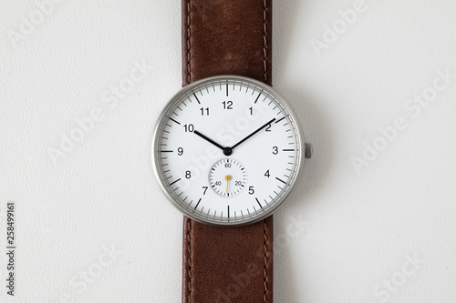 Wallpaper Mural Minimalist watch wristwatch with white dial and brown leather strap isolated on white background Torontodigital.ca