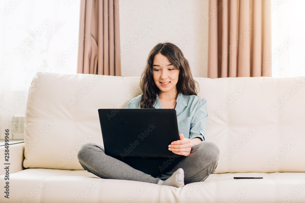 Bbeautiful woman using laptop computer at home on sofa Bbeautiful woman using laptop computer at home on sofa