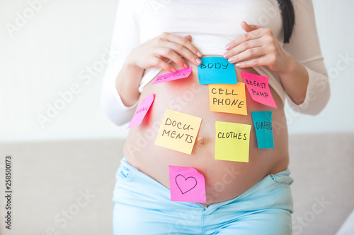 Wallpaper Mural Pregnant woman indoor. Woman preparing for childbirth. Female expecting. Lady preparing to go to maternity hospital. Torontodigital.ca