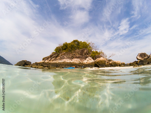 woman with a kayak on an isolated beach in Andaman sea - solo travel