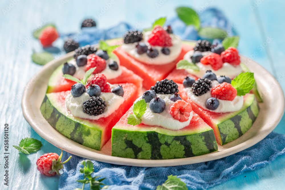 Juicy watermelon pizza with blueberries, raspberries and cream Juicy watermelon pizza with blueberries, raspberries and cream