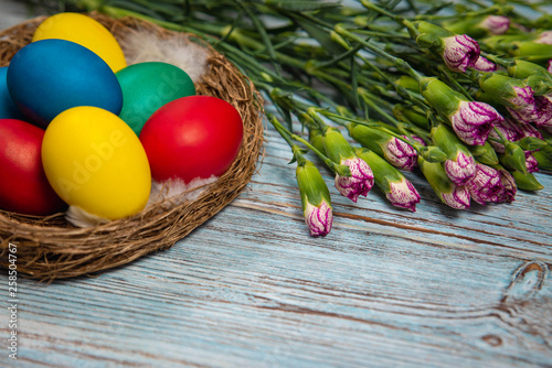 colorful Easter eggs on blue wooden background