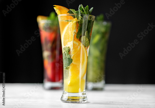 Alcoholic citrus cocktail with mint in a glass goblet. The range of drinks. Concept for drinks, summer, heat, alcohol, party and bar