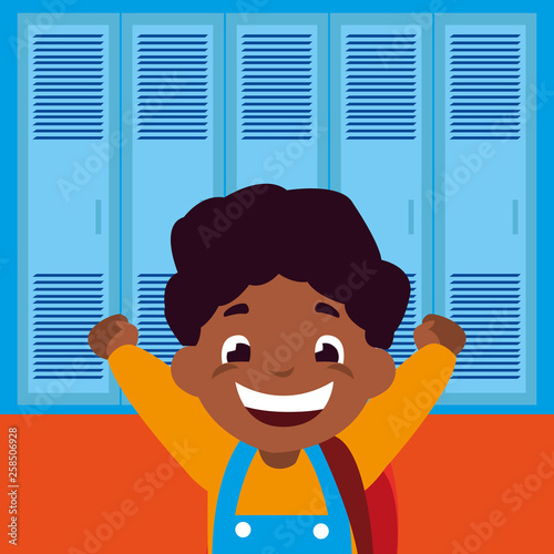little black schoolboy with schoolbag in school corridor