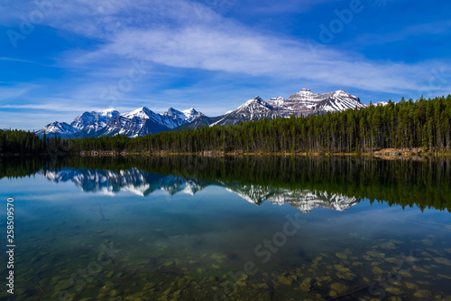Hebert Lake with snow capped mountain with reflection, Banff National Park, Alberta, Canada