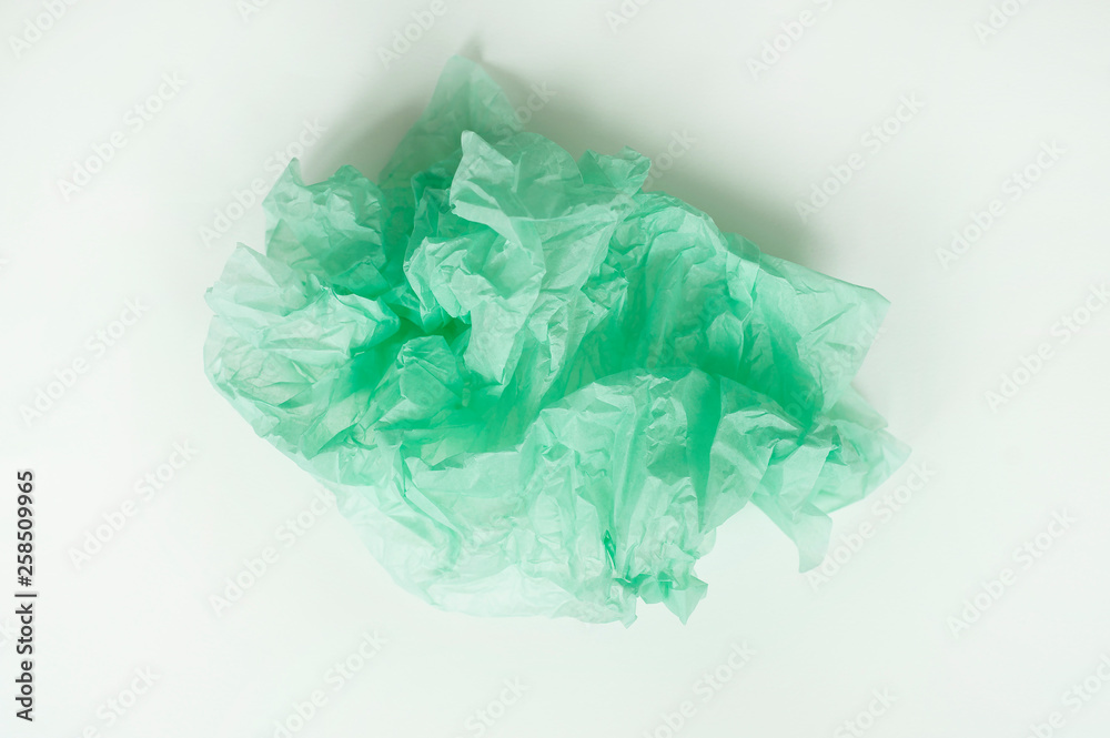 Obraz premium Tissue crumpled sheet of green floral packaging (paper)