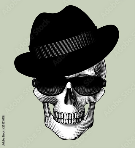 Human skull full face with black hat and sunglasses