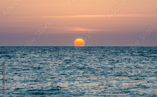 Fototapeta Naklejka Na Ścianę i Meble -  Sunset over Mediterranean Sea in Tel Aviv, Israel