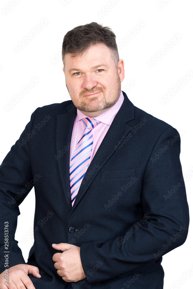 Adult promising employee of the company. Purposeful successful worker of middle years with a beard, isolated background Adult promising employee of the company. Purposeful successful worker of middle years with a beard, isolated background