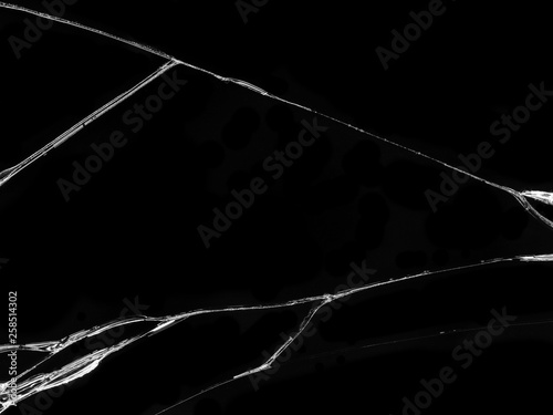 Cracked glass texture on black background. Isolated realistic cracked glass effect.