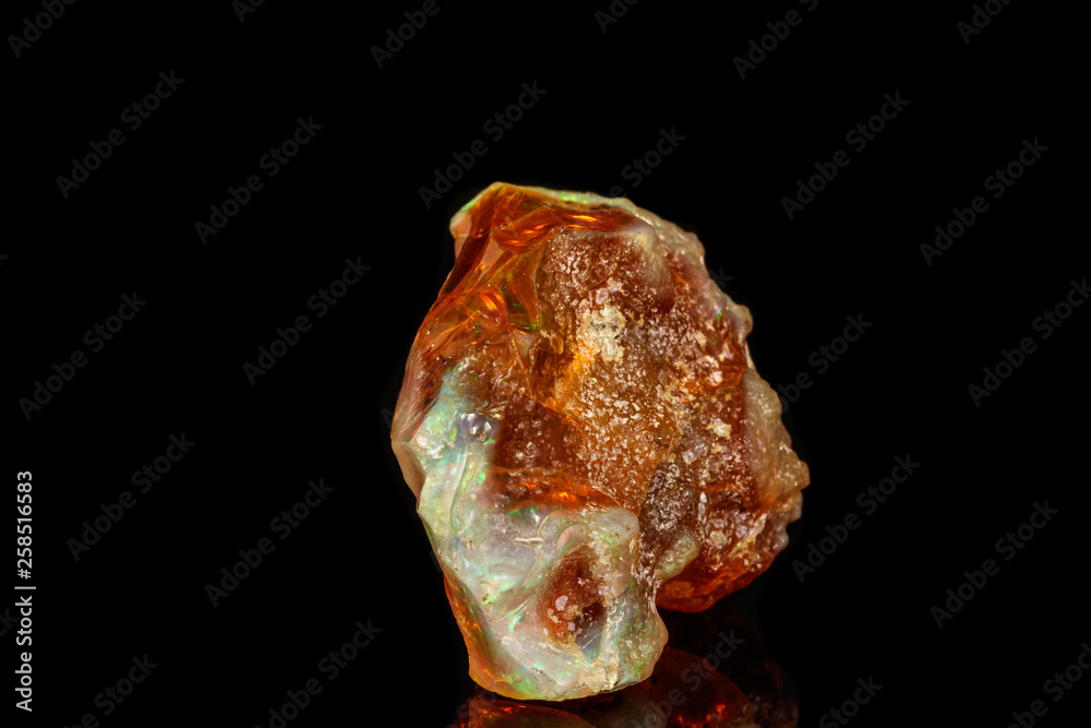 Macro stone Opal mineral in rock on a black background close up Macro stone Opal mineral in rock on a black background close up