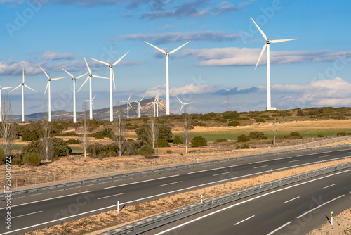 Highway on its way through a wind farm