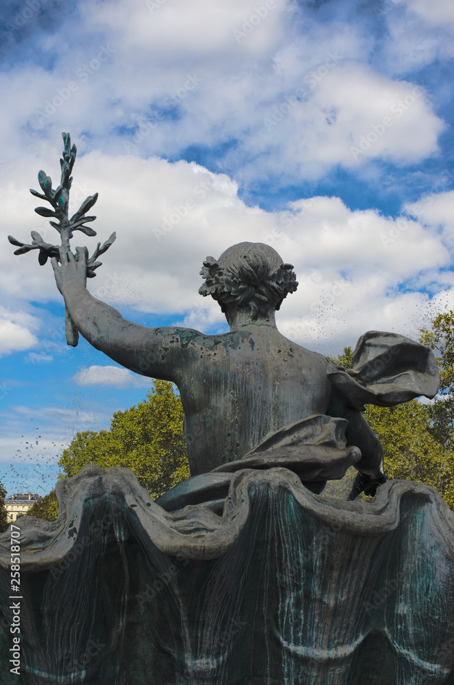 Statue of a woman holding an olive branch at Girondins monument, place des Quinconces, Bordeaux, France