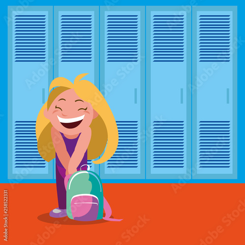 little schoolgirl with schoolbag in school corridor