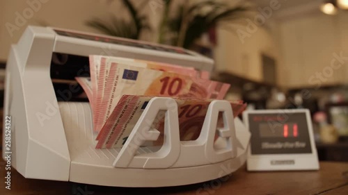 Electronic money counter with different Euro banknotes  photo