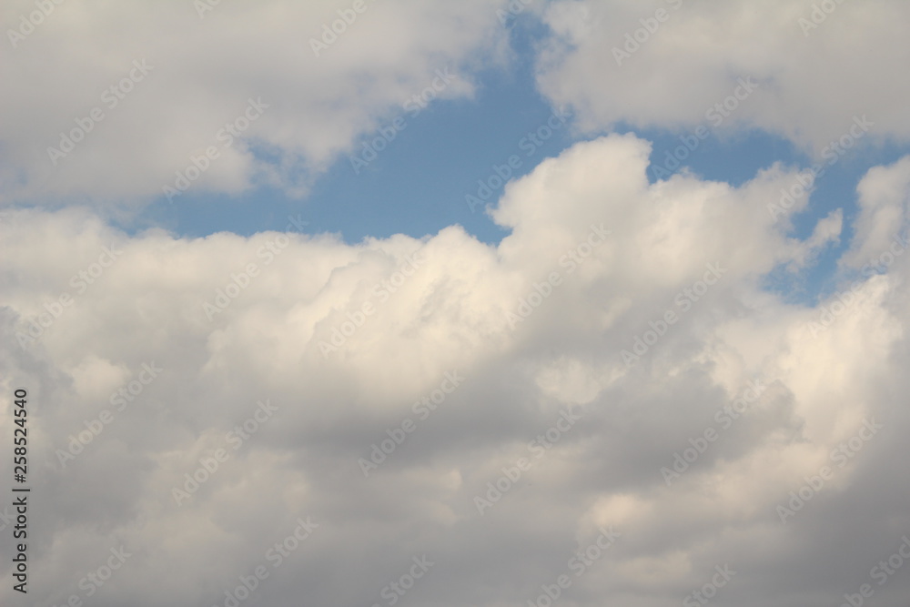 White clouds against the blue sky.