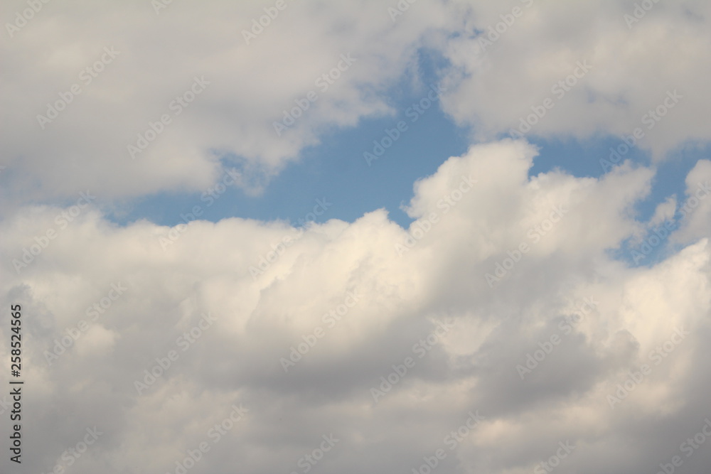 White clouds against the blue sky.