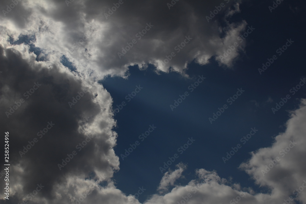 Obraz premium White clouds against the blue sky.