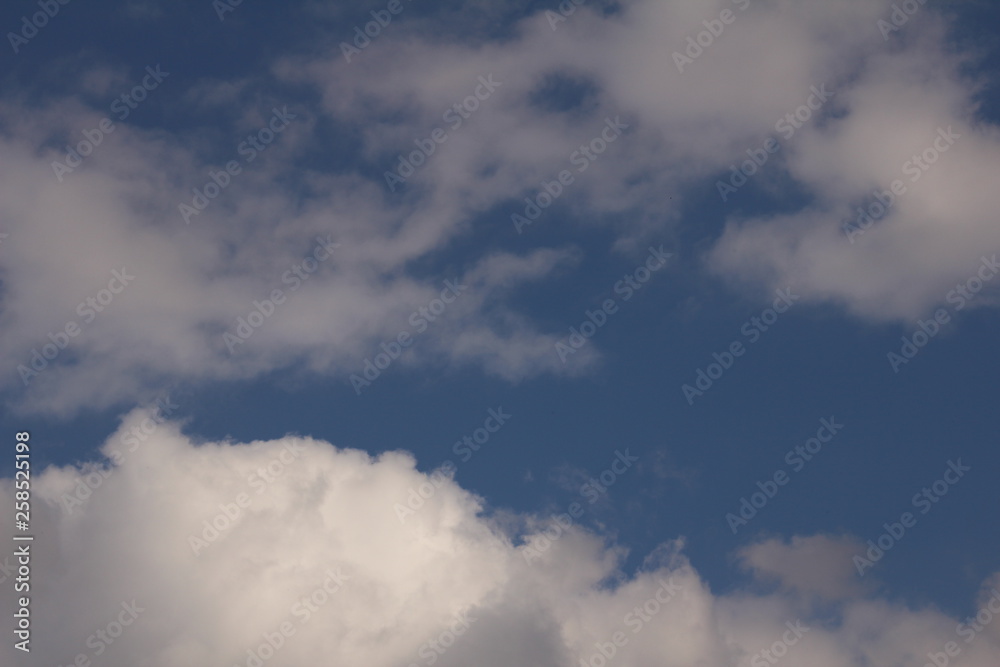 White clouds against the blue sky. White clouds against the blue sky.