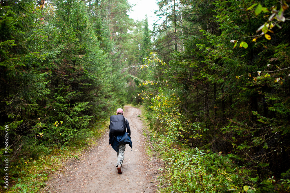 Man hiking at sunset mountains with heavy backpack Travel Lifestyle wanderlust adventure concept summer vacations outdoor alone into the wild Man hiking at sunset mountains with heavy backpack Travel Lifestyle wanderlust adventure concept summer vacations outdoor alone into the wild