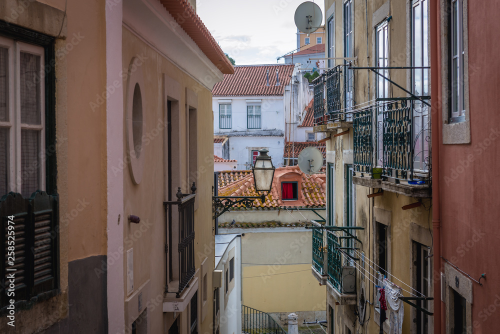 Houses on the narrow alley in Lisbon, capital city of Portugal