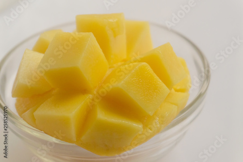 Yellow mango fruit on a white background