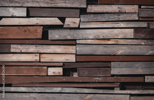 Wall of wooden boards with slits. Texture of old , brown wood