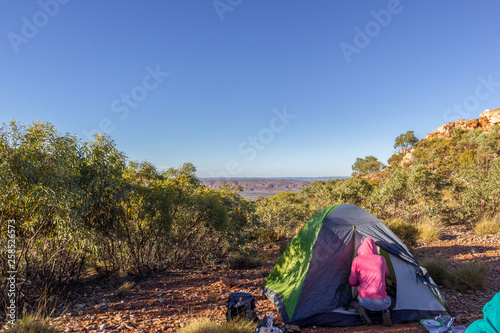 Tourist tent in camp among meadow in the mountain at sunrise with campire  australia