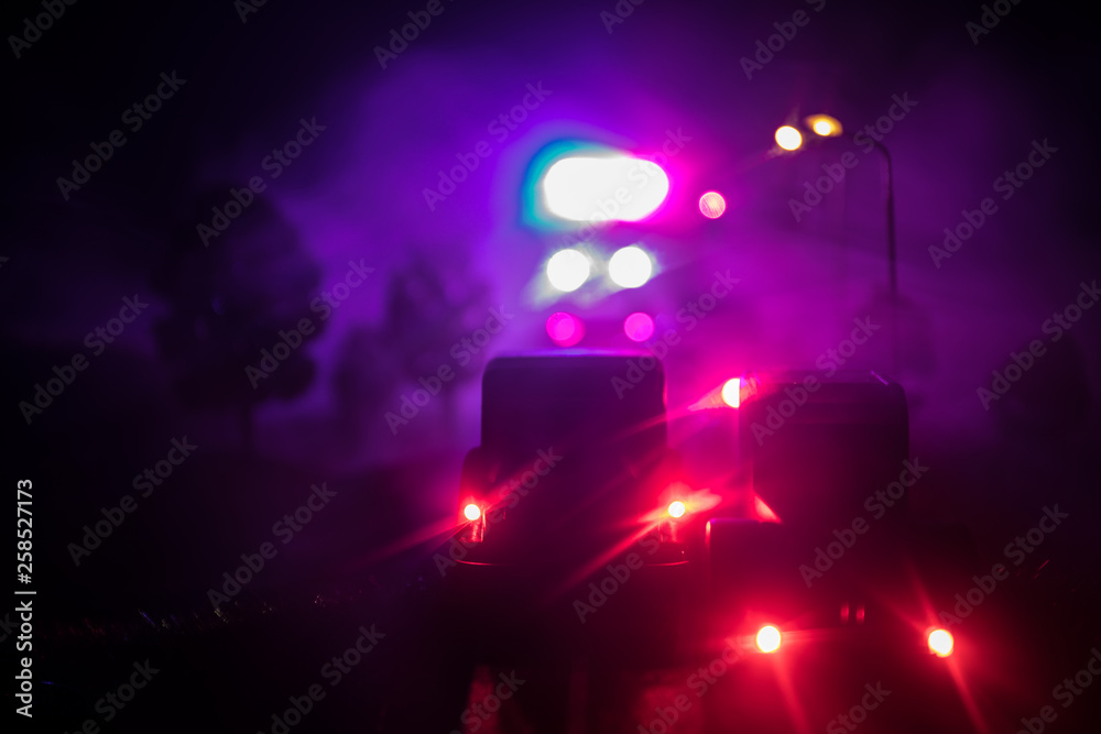 lighting of police car in the night during accident on the road. Artwork table decoration.