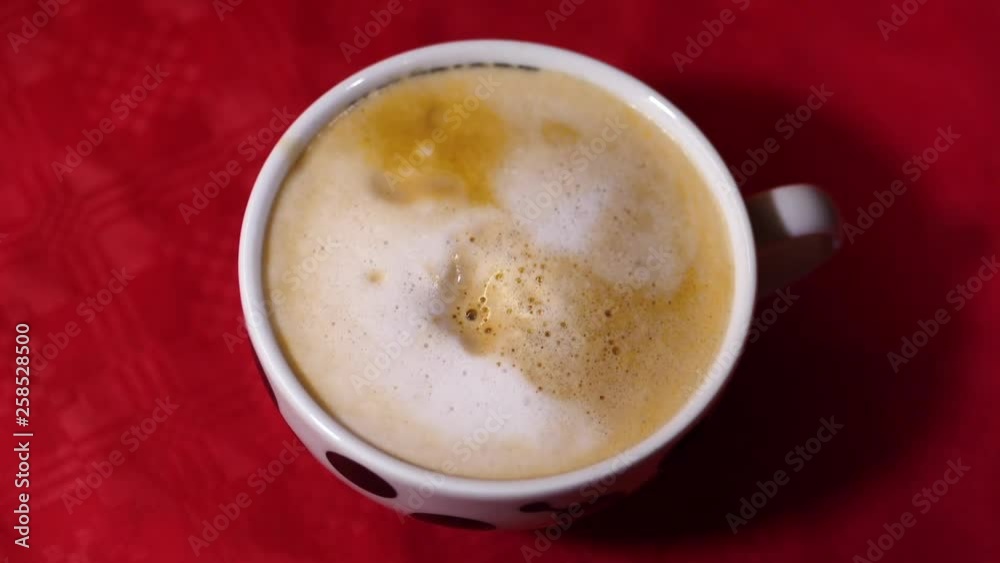 Heart face shape sugar cube drop in a coffee beverage mug, close up shot Heart face shape sugar cube drop in a coffee beverage mug, close up shot