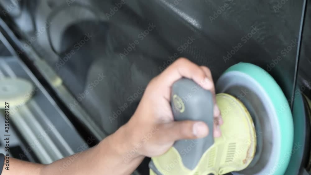 Hand of male with equipmen polishing car body service. Steps to varnish. Slow Motion Hand of male with equipmen polishing car body service. Steps to varnish. Slow Motion
