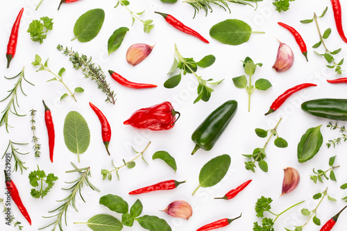 Fototapeta Naklejka Na Ścianę i Meble -  Spice herbal leaves and chili pepper on white background. Vegetables pattern. Floral and vegetables on white background. Top view, flat lay.