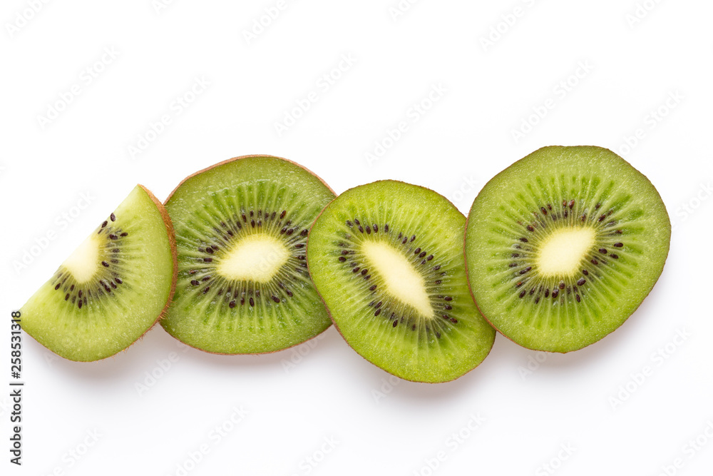 Kiwi fruit slices on white background. Kiwi fruit slices on white background.