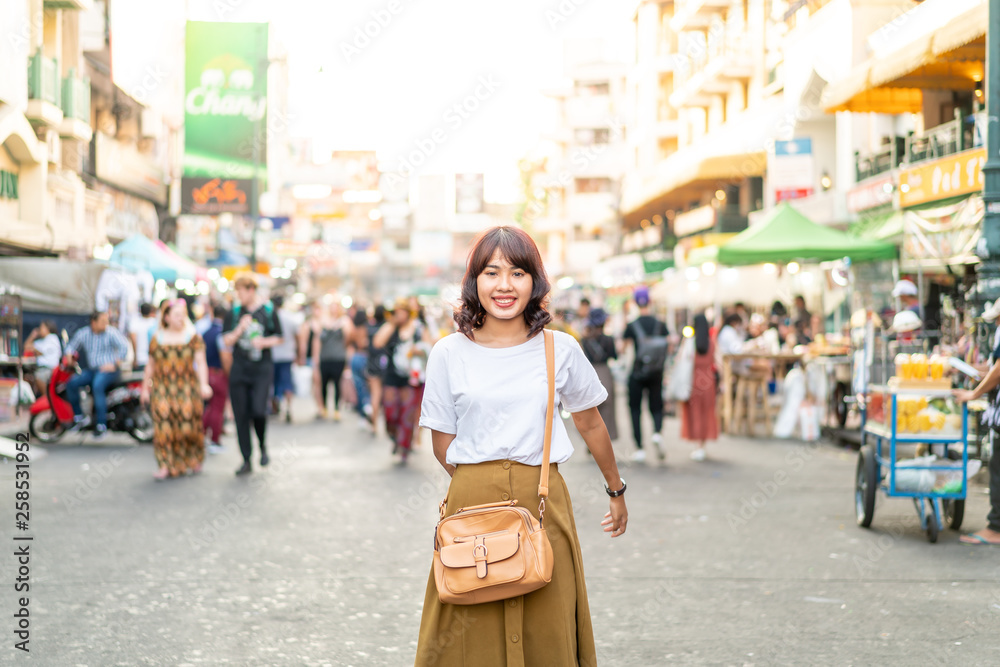 Happy and Beautiful Asian woman traveling at Khao Sarn Road, Thailand Happy and Beautiful Asian woman traveling at Khao Sarn Road, Thailand