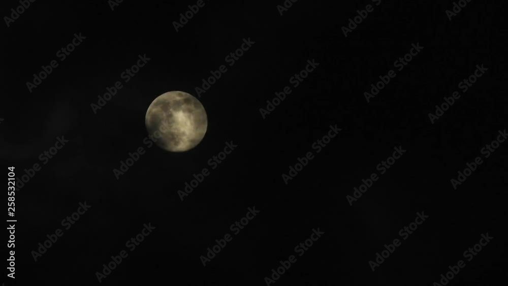 Moon with clouds passing by in the dark night sky, time lapse, cloudy, bright moon covered with clouds, highly detailed video Moon with clouds passing by in the dark night sky, time lapse, cloudy, bright moon covered with clouds, highly detailed video