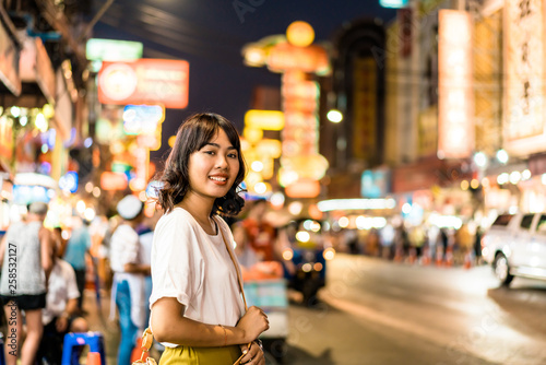 Photography Young Asian Woman Traveler with view at China Town in Bangkok, Thailand