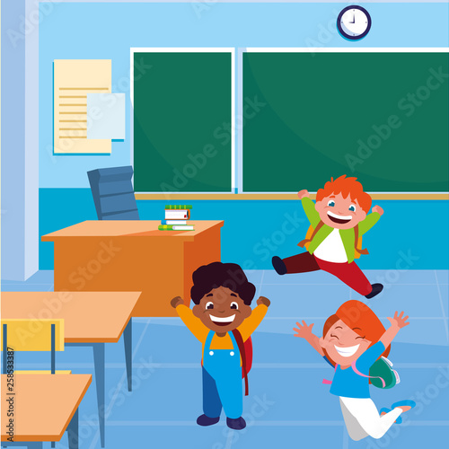 happy little interracial school kids in the classroom