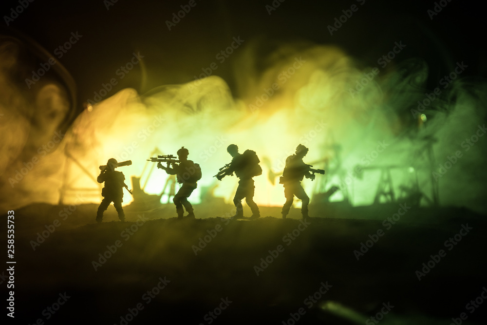 Silhouette of military soldier or officer with weapons. shot, holding gun, colorful sky, background. war and military concept.