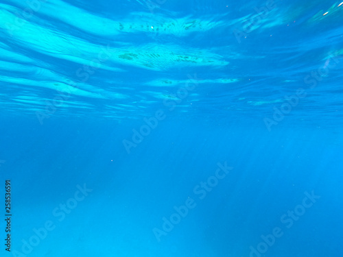 Beautiful texture of the sea and ocean water. blue background. Underwater photography. Red Sea, Egypt.