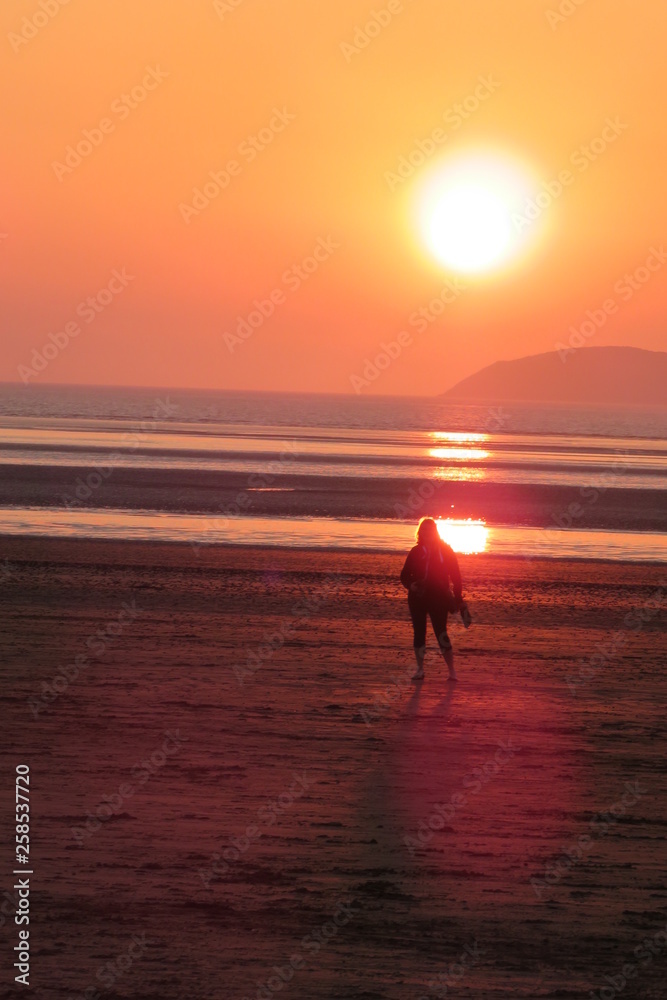 Sunset over the beach western super mare England coastline Sunset over the beach western super mare England coastline