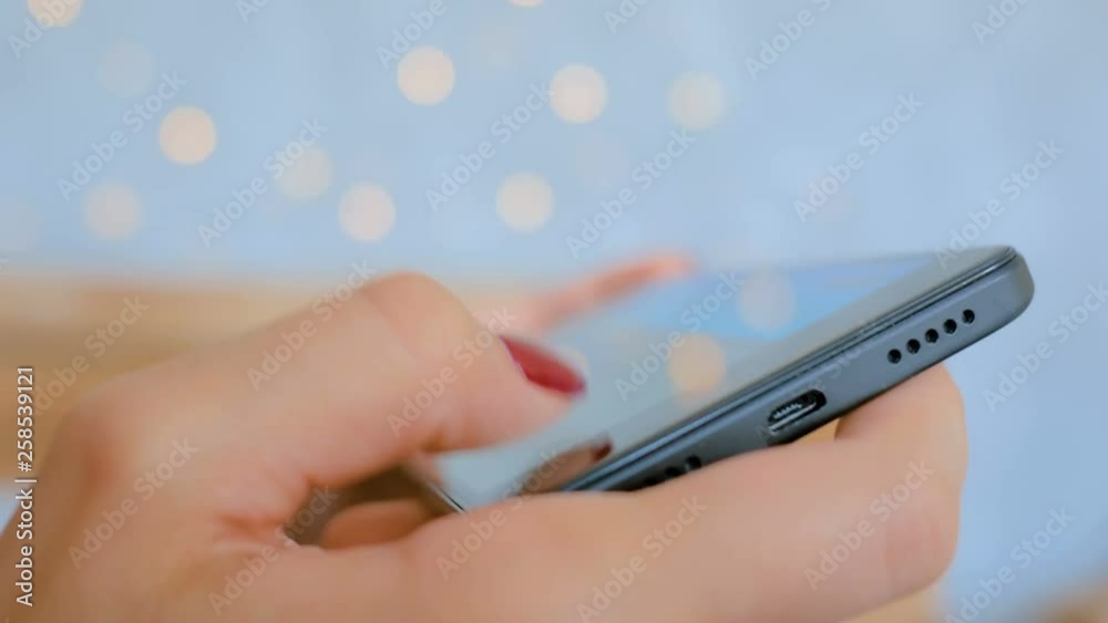 Woman gamer playing mobile game with smartphone. Gaming, hobby, technology and leisure time concept Woman gamer playing mobile game with smartphone. Gaming, hobby, technology and leisure time concept