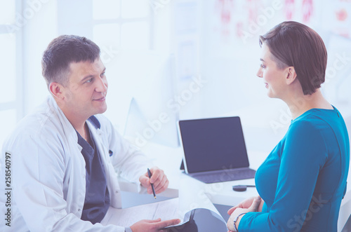 The patient and his doctor in medical office photo