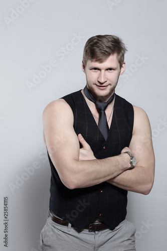 young businessman in a tie without a shirt