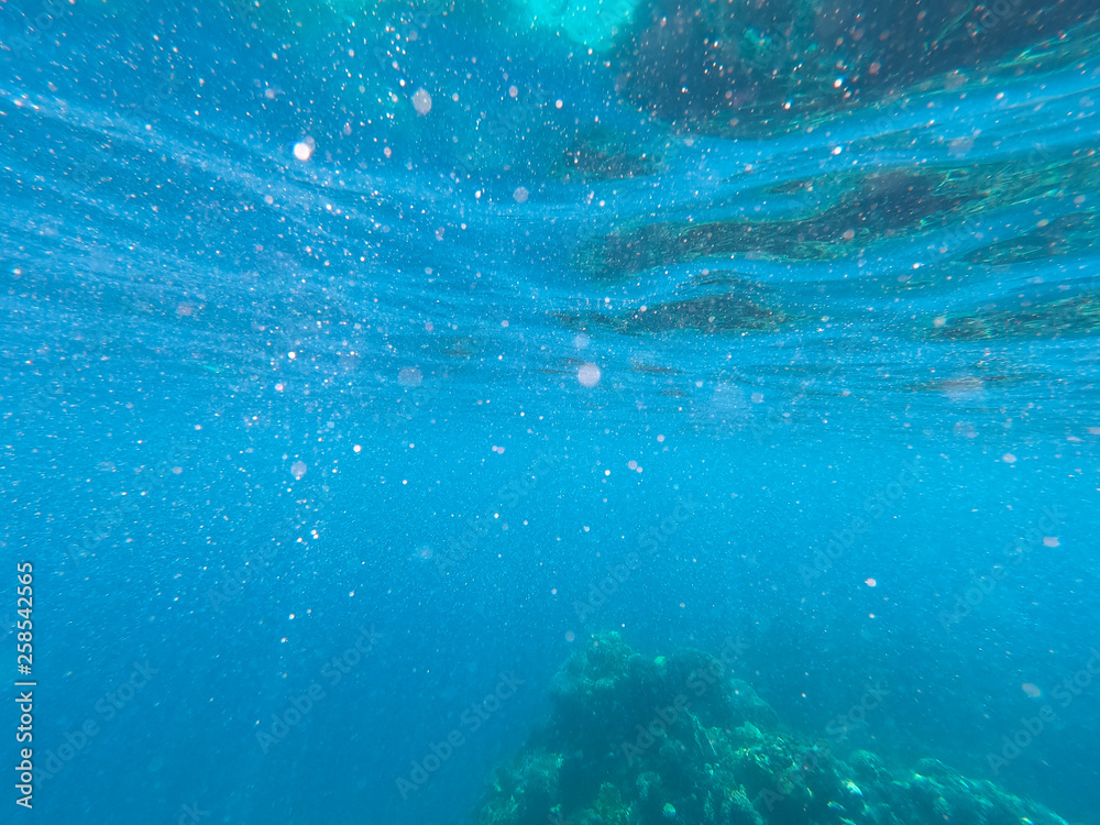 Beautiful texture of the sea and ocean water. blue background. Underwater photography. Red Sea, Egypt.