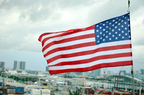 American flag over the port of Miami, Florida.