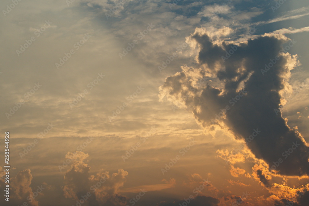 Obraz premium Sun rays through clouds like a dramatic explosion. Abstract nature background. 