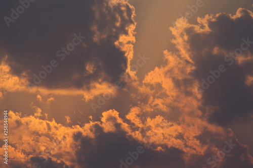 Sun rays through clouds like a dramatic explosion. Abstract nature background. 