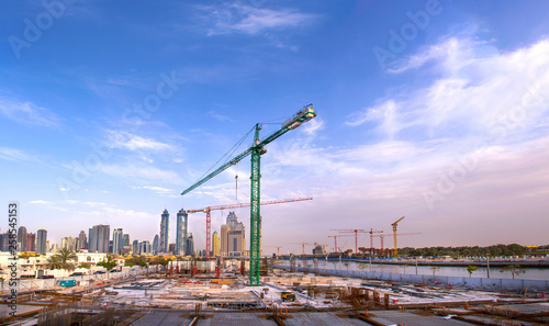 Canvas Print construction site with Large Crane modern building foundation in dubai Business