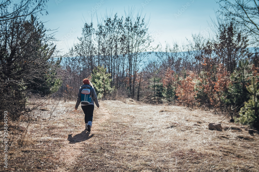 Hipster young girl hiking holiday, wild adventure at National Park
